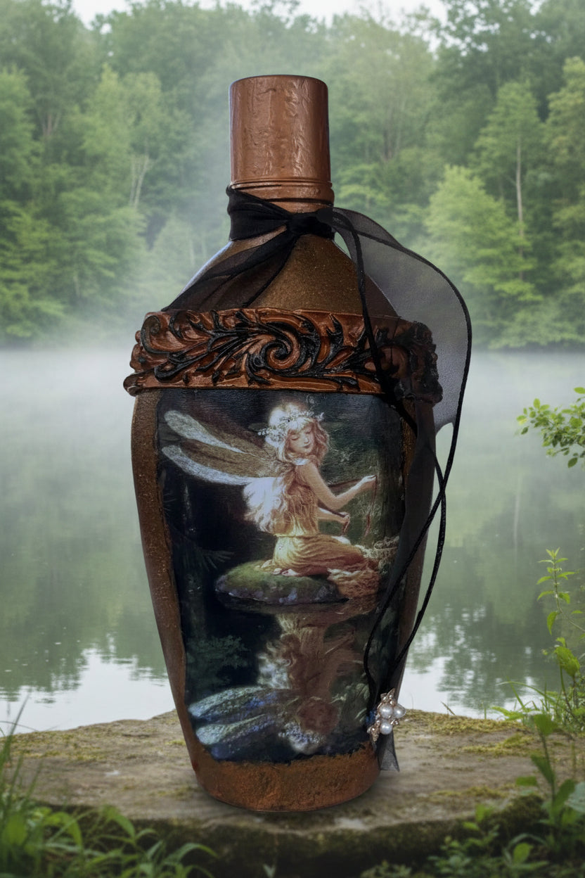 Decorative fairy bottle with brown finish, black ribbon bow, illustrated front