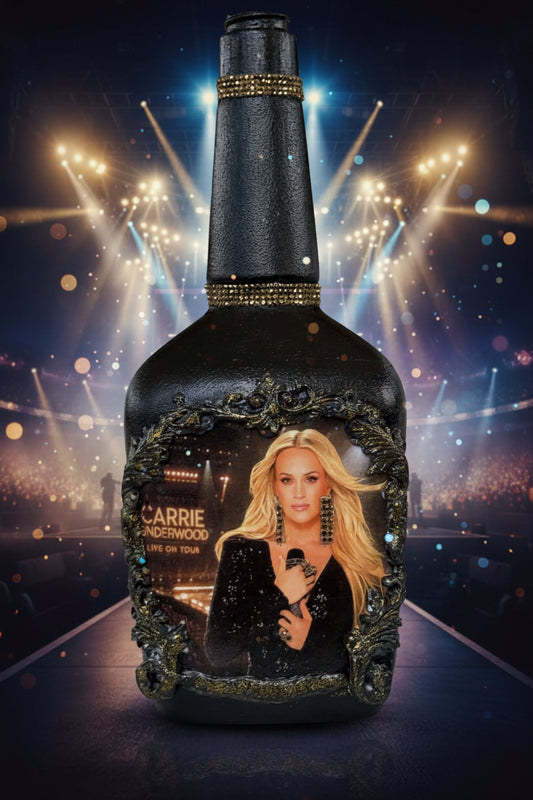 Decorative dark bottle with gold glitter, portrait label, and gold lettering