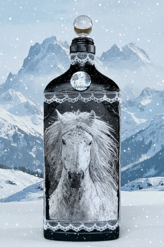 Decorative black bottle with white horse face and lace trim